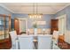 Bright dining room featuring elegant furniture and a decorative chandelier fixture at 448 Union S St, Concord, NC 28025