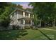 Charming two-story home with a well-kept lawn and mature trees, offering a peaceful suburban setting at 448 Union S St, Concord, NC 28025