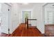 Upstairs hallway with hardwood floors and white trim at 448 Union S St, Concord, NC 28025