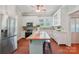 Bright kitchen with stainless steel appliances, butcher block island and hardwood floors at 448 Union S St, Concord, NC 28025
