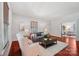 Bright living room featuring hardwood floors, neutral decor, and stylish furniture, perfect for entertaining at 448 Union S St, Concord, NC 28025