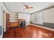 This living room has a decorative fireplace, built-in shelves, and hardwood floors at 448 Union S St, Concord, NC 28025