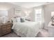 Comfortable bedroom with soft, neutral colors, a cozy bed, and ample natural light creating a relaxing space at 490 Lenswood Ct, Denver, NC 28037