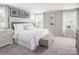 Serene main bedroom with a large bed, soft lighting, and elegant decor, providing a peaceful retreat at 490 Lenswood Ct, Denver, NC 28037