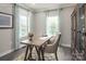 Bright office space featuring a wooden desk, globe, decor, and lots of natural light from the windows at 490 Lenswood Ct, Denver, NC 28037
