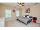Neutral bedroom featuring natural light and comfortable carpet at 5004 Woodview Ln, Matthews, NC 28104