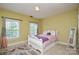 Comfortable bedroom with two large windows and neutral carpet at 5004 Woodview Ln, Matthews, NC 28104