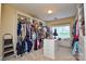 Spacious walk-in closet with custom shelving and storage solutions at 5004 Woodview Ln, Matthews, NC 28104