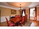 Elegant dining room featuring a wood table with seating for six, plus decorative lighting and rich wooden accents at 5004 Woodview Ln, Matthews, NC 28104