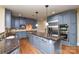 Well-appointed kitchen features a large island, granite countertops, stainless steel appliances, and custom cabinetry at 5004 Woodview Ln, Matthews, NC 28104