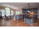 Charming kitchen with a breakfast table, custom cabinets, hardwood floors, and abundant counter space at 5004 Woodview Ln, Matthews, NC 28104