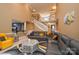 Comfortable living room with an open concept view to the kitchen, featuring a fireplace and plenty of seating at 5004 Woodview Ln, Matthews, NC 28104
