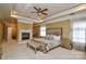 Bright main bedroom features a fireplace, hanging chair, and a decorative bed at 5004 Woodview Ln, Matthews, NC 28104