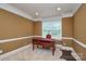 Well-lit office featuring crown molding and a large window view at 5004 Woodview Ln, Matthews, NC 28104