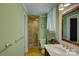 Clean bathroom with a tiled shower, updated fixtures, and plenty of natural light at 504 S Hayne St, Monroe, NC 28112