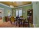 Inviting dining room with wood-paneled ceiling and a large area rug at 504 S Hayne St, Monroe, NC 28112