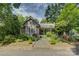 Charming home with manicured landscaping, stone walkway, and inviting front porch at 504 S Hayne St, Monroe, NC 28112