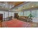 Bright living room featuring hardwood floors, a comfortable sofa, and large windows at 504 S Hayne St, Monroe, NC 28112