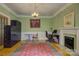 Bright home office with built-in storage, fireplace, and ample workspace at 504 S Hayne St, Monroe, NC 28112