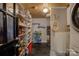 Organized pantry with tile floor, wooden ceiling, and shelving, perfect for storage and organization at 504 S Hayne St, Monroe, NC 28112