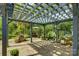 Backyard pergola with an outdoor seating area surrounded by lush landscaping at 504 S Hayne St, Monroe, NC 28112