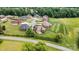 Aerial view of homes with manicured lawns and mature trees in a residential neighborhood at 5163 Meadow Park Ln, Hickory, NC 28602