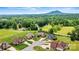 Aerial view of property in a serene neighborhood surrounded by lush greenery and mature trees at 5163 Meadow Park Ln, Hickory, NC 28602