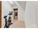 Finished attic area with exercise bike and doorway views to the home's interior at 5163 Meadow Park Ln, Hickory, NC 28602