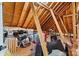 Unfinished attic storage area with visible beams and a variety of stored items at 5163 Meadow Park Ln, Hickory, NC 28602