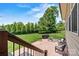 Inviting backyard patio with outdoor seating, fire pit, and a lush green lawn at 5163 Meadow Park Ln, Hickory, NC 28602