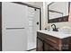 Bathroom with dark wood vanity, white counter, and glass enclosed shower at 5163 Meadow Park Ln, Hickory, NC 28602