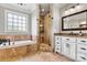 Beautiful bathroom featuring a soaking tub, a frameless shower, and a granite-topped vanity at 5163 Meadow Park Ln, Hickory, NC 28602