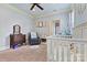Cozy Bedroom featuring neutral tones, carpet, and a lovely view; a warm and inviting space for your little one at 5163 Meadow Park Ln, Hickory, NC 28602