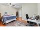 Bedroom featuring wood floors, a large bed, desk area, and decor at 5163 Meadow Park Ln, Hickory, NC 28602