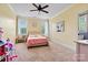 Bright bedroom with carpet flooring and natural light; ideal for children or guests at 5163 Meadow Park Ln, Hickory, NC 28602