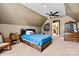 Cozy bedroom with a bed, ceiling fan, carpeted floors, and a vintage dresser with mirror at 5163 Meadow Park Ln, Hickory, NC 28602