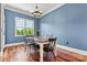 Bright dining room with hardwood floors and a large window overlooking the backyard at 5163 Meadow Park Ln, Hickory, NC 28602