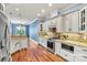 This kitchen features stainless appliances, granite countertops, custom cabinets, and an eat-in bar at 5163 Meadow Park Ln, Hickory, NC 28602