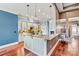 Bright kitchen featuring custom cabinets, granite countertops, pendant lighting, and an eat-in bar at 5163 Meadow Park Ln, Hickory, NC 28602