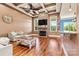 Bright living room featuring hardwood floors, stone fireplace, large windows, and open layout at 5163 Meadow Park Ln, Hickory, NC 28602