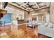 Spacious living room features coffered ceilings and hardwood floors, seamlessly connected to a modern, eat-in kitchen at 5163 Meadow Park Ln, Hickory, NC 28602