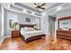 Spacious main bedroom with hardwood floors, tray ceilings, and large windows that flood the room with natural light at 5163 Meadow Park Ln, Hickory, NC 28602