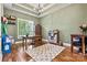 Well-lit office with hardwood floors, built-in shelving, and a large window at 5163 Meadow Park Ln, Hickory, NC 28602