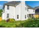 The home's backyard features lush greenery, a white fence, and ample space at 5227 Eagle Creek Dr, Charlotte, NC 28269