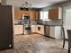 Modern kitchen with stainless steel appliances, light cabinets, and tile flooring at 5227 Eagle Creek Dr, Charlotte, NC 28269