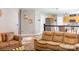 Spacious living room with tan sofas, open to the kitchen, and tiled floors at 5227 Eagle Creek Dr, Charlotte, NC 28269
