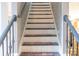Painted staircase with alternating treads with decorative handrail at 5227 Eagle Creek Dr, Charlotte, NC 28269