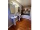 Bathroom with pedestal sinks and tiled shower/bath, offering a luxurious spa-like experience at 524 Railroad Nw Dr, Concord, NC 28025
