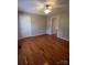 Cozy bedroom featuring hardwood floors, neutral tones, and plenty of space for living and relaxing at 524 Railroad Nw Dr, Concord, NC 28025