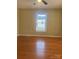 Cozy bedroom with hardwood floors, natural light, and a ceiling fan for added comfort at 524 Railroad Nw Dr, Concord, NC 28025